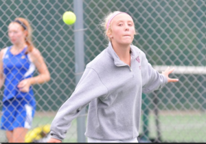 Badger High School girls tennis player Claudia Huerth hits a backhand slice.